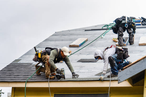Professional Roofing technician working in Center Moriches, NY